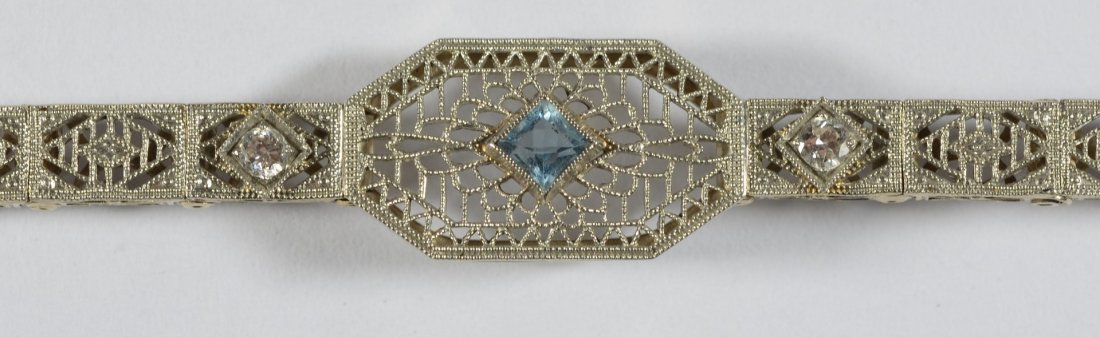 14K WG filigree bracelet 2 small diamonds, pale green: 14K WG filigree bracelet 2 small diamonds, pale green stone, 6 7/8" l, 5.7 dwt