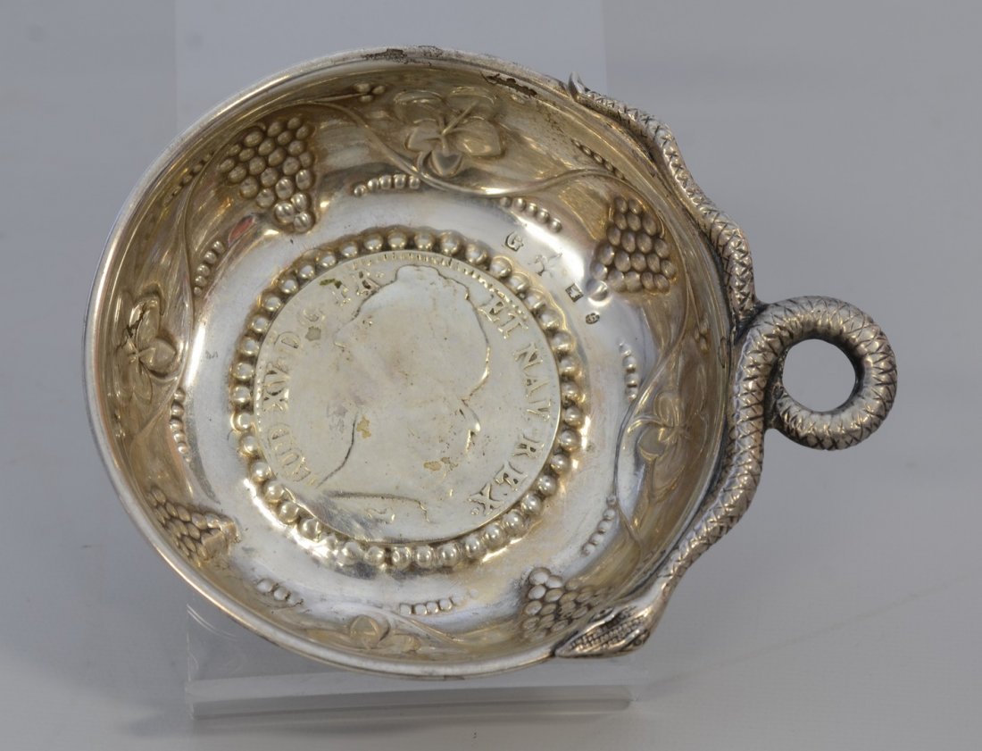 French silver wine taster with Louis XV 1764 coin set: French silver wine taster with Louis XV 1764 coin set in base, serpent handle, 2.63 TO, 3 1/4" d, grape vine and cluster embossed decoration, hallmarked as shown in photos