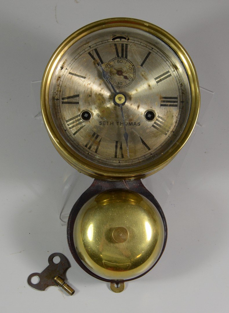 Seth Thomas Ship's Bell clock, brass with a silvered: Seth Thomas Ship's Bell clock, brass with a silvered dial, some wear, marked Seth Thomas, with external bell, 5-1/2" dial, 10-1/2" high overall