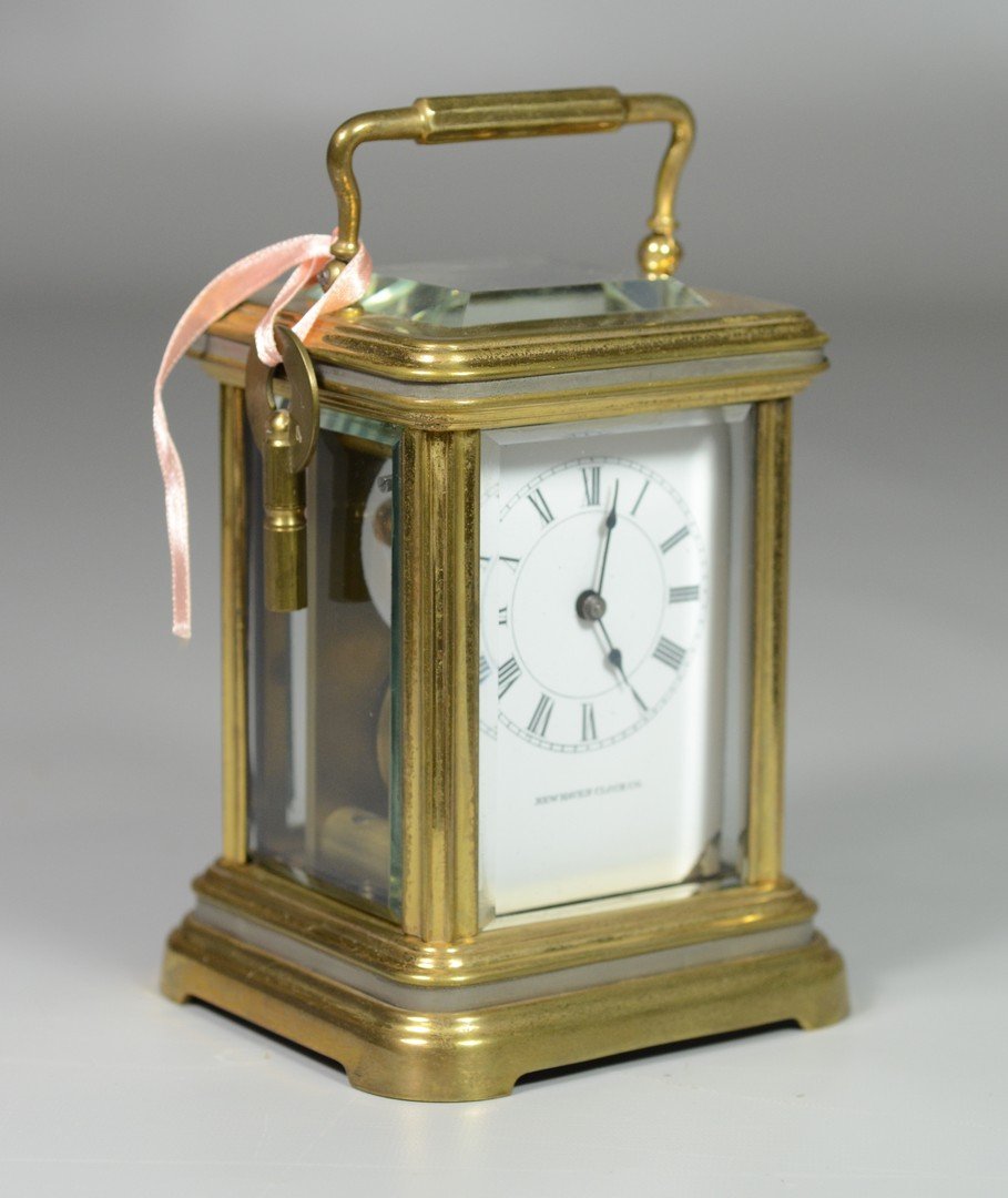 New Haven carriage clock, 6 1/4" tall to top of handle,: New Haven carriage clock, 6 1/4" tall to top of handle, 5 beveled glass panels in good condition, white enameled dial in excellent condition marked "New Haven Clock Co", wound tight