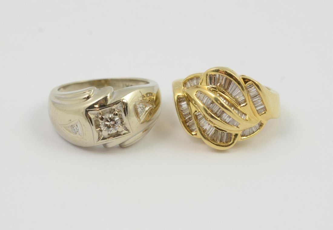 (2) 14K gold rings, one white gold with about 45 or mor: (2) 14K gold rings, one white gold with about 45 or more channel set tapered baguette diamonds, 4.5 dwt, size 5 1/4; the other yellow gold with 3 diamonds, 4.2 dwt, size 7