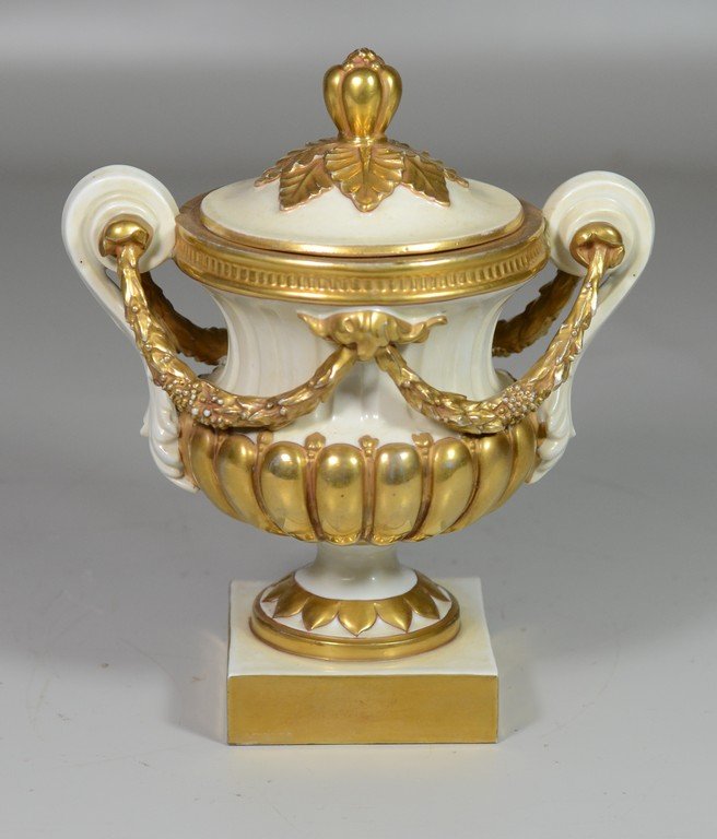 Gilt decorated porcelain covered urn marked Germany to: Gilt decorated porcelain covered urn marked Germany to the underside, by Volkstedt, 8 1/2" h