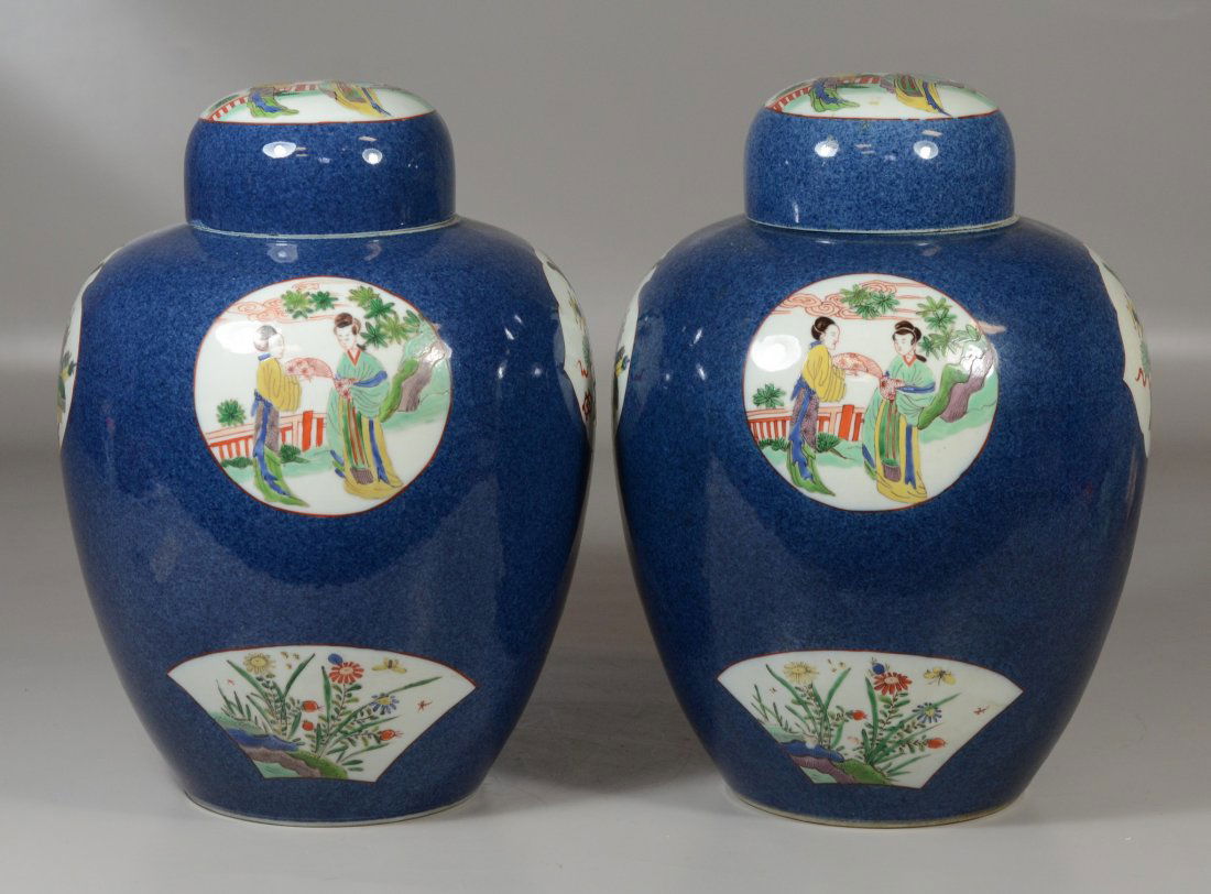 Pair of Chinese powdered blue ginger jars with Famille: Pair of Chinese powdered blue ginger jars with Famille Vert reserves "1000 antiques" and ladies in gardens, blue double ring mark to base, small chip to underside of one lid and larger chip to undersi