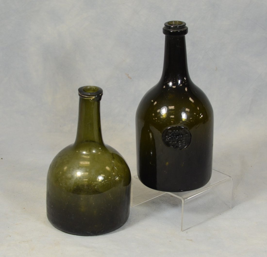 Deep olive green sealed wine bottle, "CHH Sillaton: Deep olive green sealed wine bottle, "CHH Sillaton 1789", 9" h; with an unmarked olive gin bottle. Ex: Collection of Irvin & Anita Schorsch, Hidden Glen Farms, 90, 644