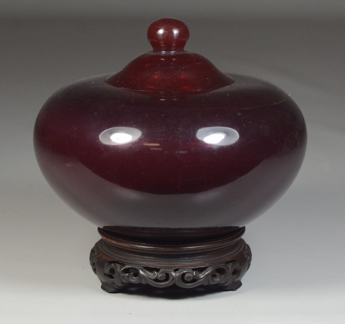 Ruby Peking glass covered jar with wooden base, chips (1 of 5)