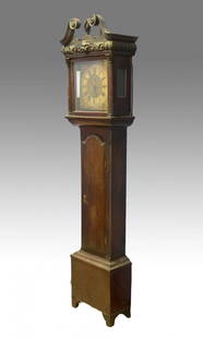 Mahogany Georgian Irish 8 day tall case clock with: Mahogany Georgian Irish 8 day tall case clock with square brass dial signed Charles Craig, Dublin, c 1770-90, scroll top bonnet with flame finial, foliate and lion head carved band above door, arched