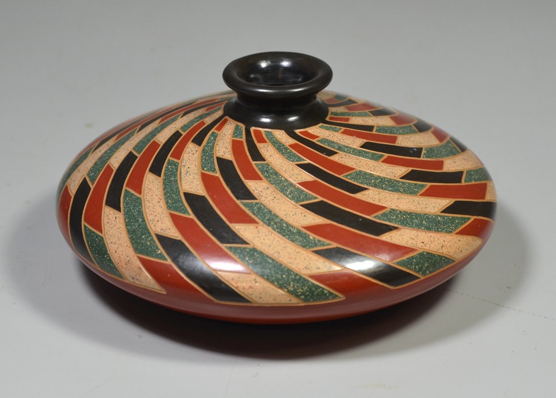 Squat red glazed pottery bowl with swirled mosiac desin (1 of 2)