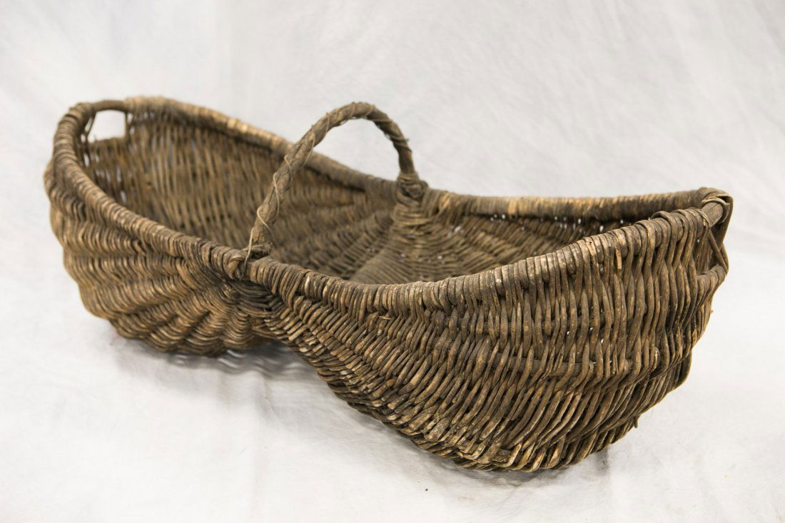 Oversized twig and rattan woven buttocks basket, (1 of 2)