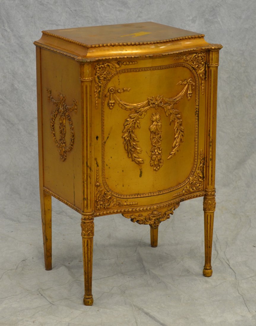 Gilt decorated Louis XVI style music cabinet,: Gilt decorated Louis XVI style music cabinet, serpentine front, 22" w, 37" h, 19th c, 5 shelf interior