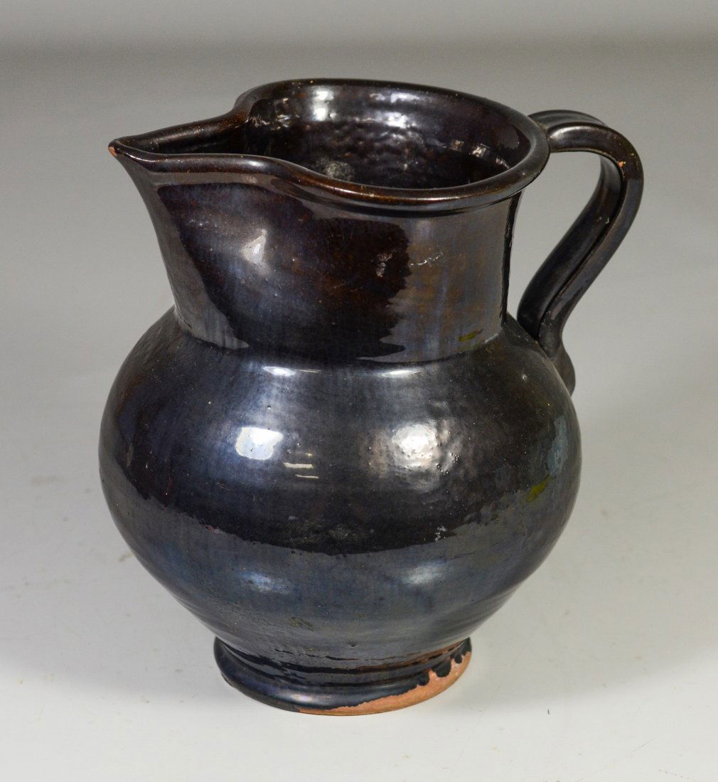 Black glazed bulbous redware pitcher,  8" tall,  chips (1 of 3)