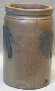 Salt glazed stoneware crock: Salt glazed stoneware crock, blue glaze leaf decoration, 10 1/4" high, rep'd chip on rim.