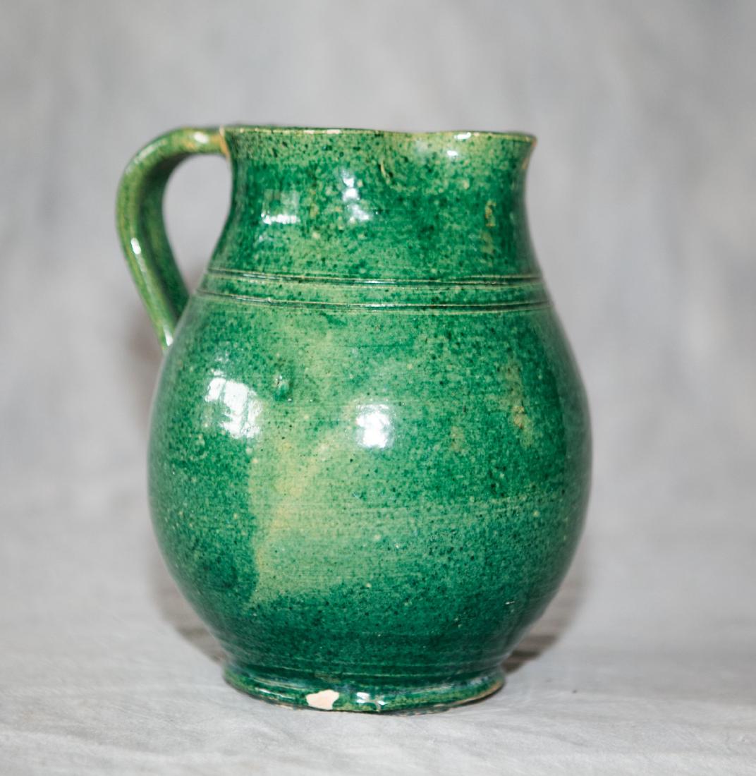 Green glazed graniteware bulbous pitcher, edge fritting (1 of 5)