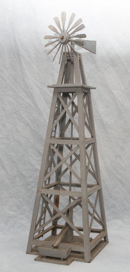 Gray painted wood windmill tower with water pump at: Gray painted wood windmill tower with water pump at base, 29" h, some paint loss