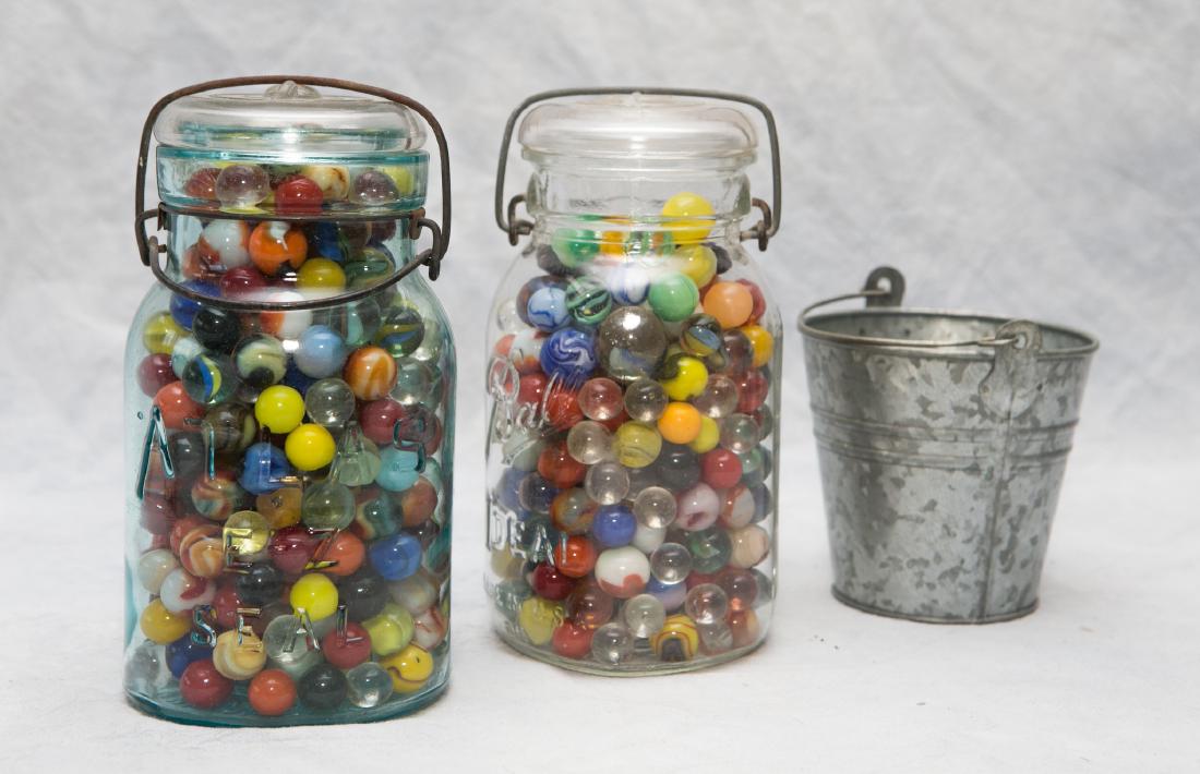 (2) Fruit jars filled with marbles, & tin bucket of (1 of 2)