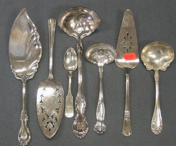 Seven assorted silver plated fish servers, ladle