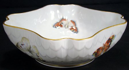LIMOGES BOWL WITH BUTTERFLIES: APPROX. 7 1/2 INCHES DIAMETER, MOLDED OVERLAPPING LEAVES WITH GOLD TRIM ; HANDPAINTED ENAMELED BUTTERFLIES IN MULTIPLE COLORS. MARKED B AND CO. LIMOGES FRANCE. L BERNARDAUD AND CO. FREE SHIPPING AND I