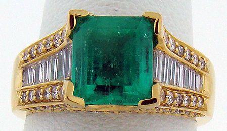 18KT Y.G. 4.50CT EMERALD AND DIAMOND RING