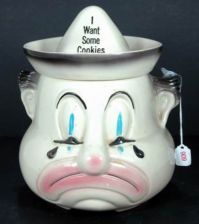 VINTAGE SAD CLOWN COOKIE JAR: APROX 8 INCHES, SHIPPING TO BE $20. PLUS INS