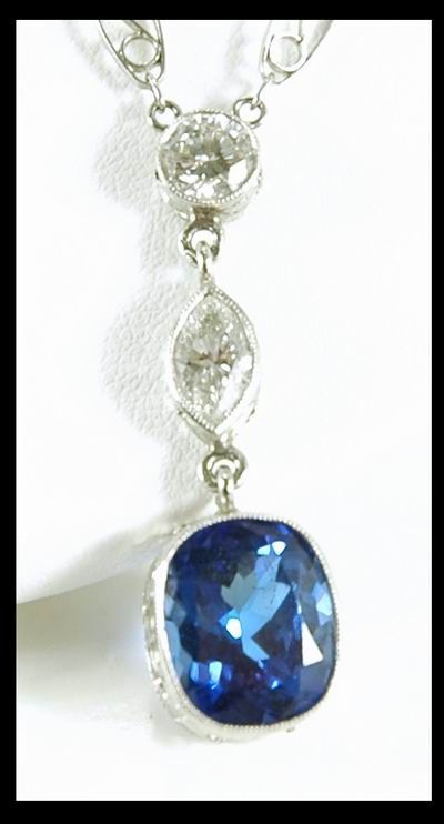6.00CT TANZANITE AND PLATINUM DIAMOND PENDANT - 2
