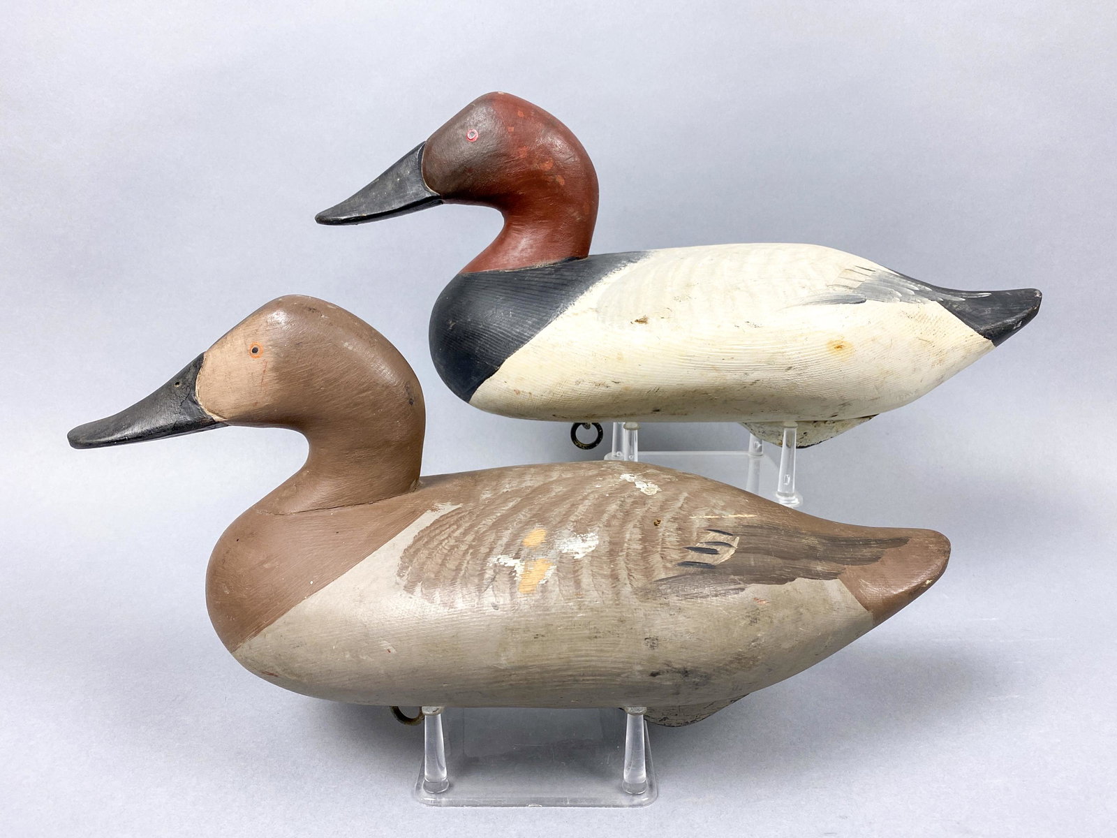 Madison Mitchell Pair of Canvasback Duck Decoys, Havre: Madison Mitchell Pair of Canvasback Duck Decoys, Havre de Grace, MD, painted eyes, solid bodies, good original paint with nice detail, drake is signed in electro pen and dated "1958" on bottom, 16"L, 