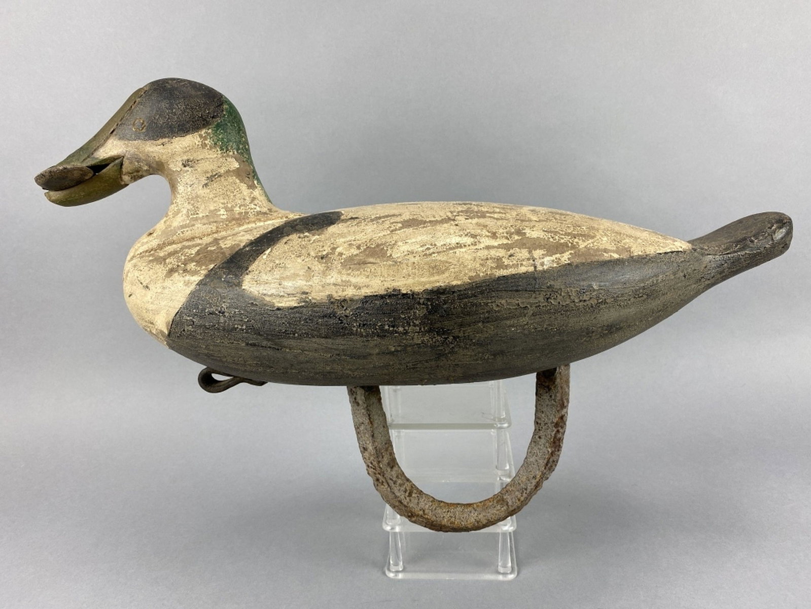 Eider Duck Decoy: by unknown east coast carver, oversized solid body with large cast iron weight, excellent form holding muscle in mouth, bill repair, aged patina & some flaking, 21"L, est. 200 - 400