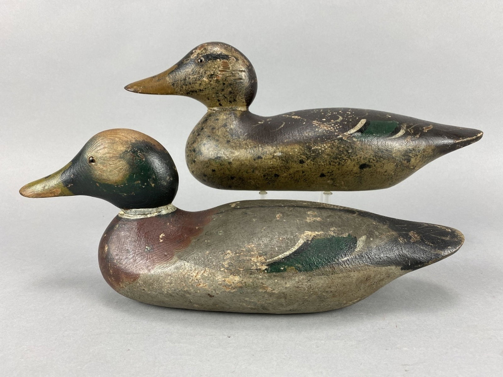 Mason Pr of Mallard Duck Decoys: Detroit, MI, standard grade, glass eyes, solid bodies, hen is original paint with light wear, some flaking & light paint loss, age crack in head, drake is mostly original paint with gunning wear, touc