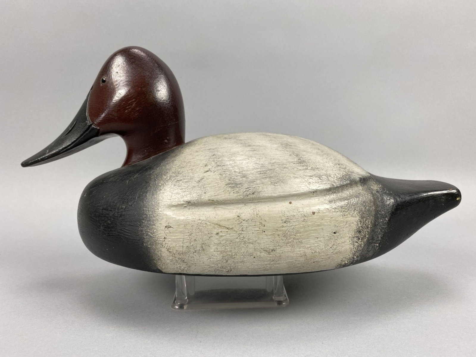 Craig Ebner Canvasback Drake Duck Decoy: Mt. Clemens, MI, glass eyes, solid body, strong original paint with light wear, 16"L, est. 100 - 200