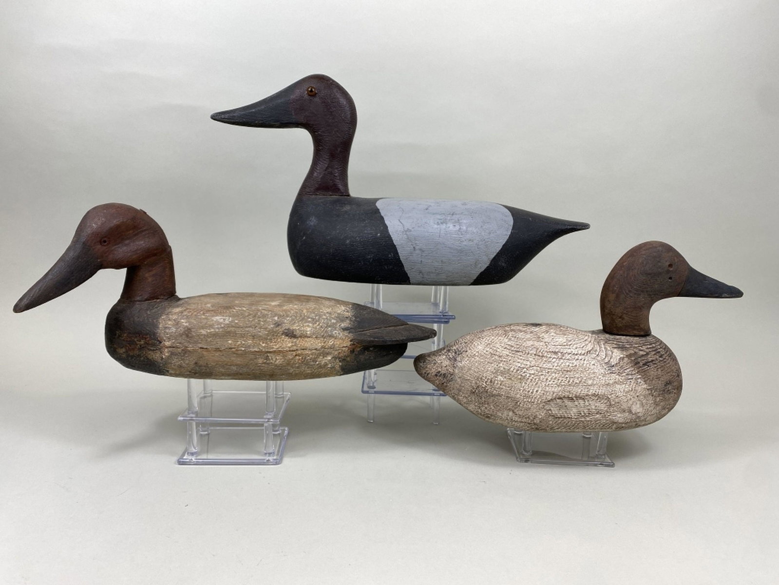 3 Vintage Canvasback Duck Decoys: by unknown carvers, 2 have glass eyes, 1 is missing eyes, 1 has hollow body, 2 have solid bodies, all repainted with significant wear, seam separations, age cracks & neck cracks, Steve Weller Collecti