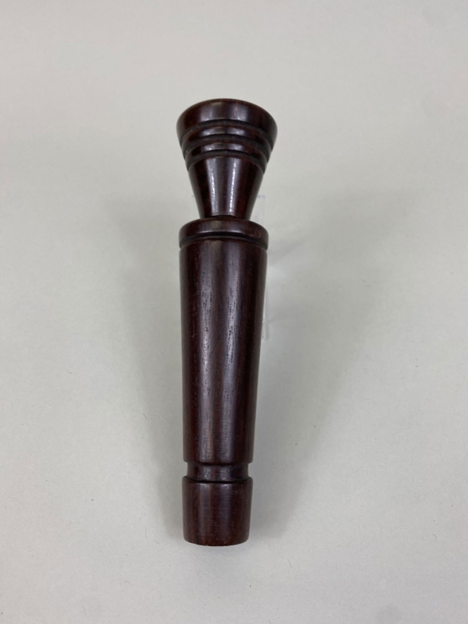 Wooden Duck Call by Unknown Maker: Large wooden duck call with a bell like stopper, brass reed, very well made, all original, Phillip "Sonny" Cain Collection, 7"L, est. 200 - 300