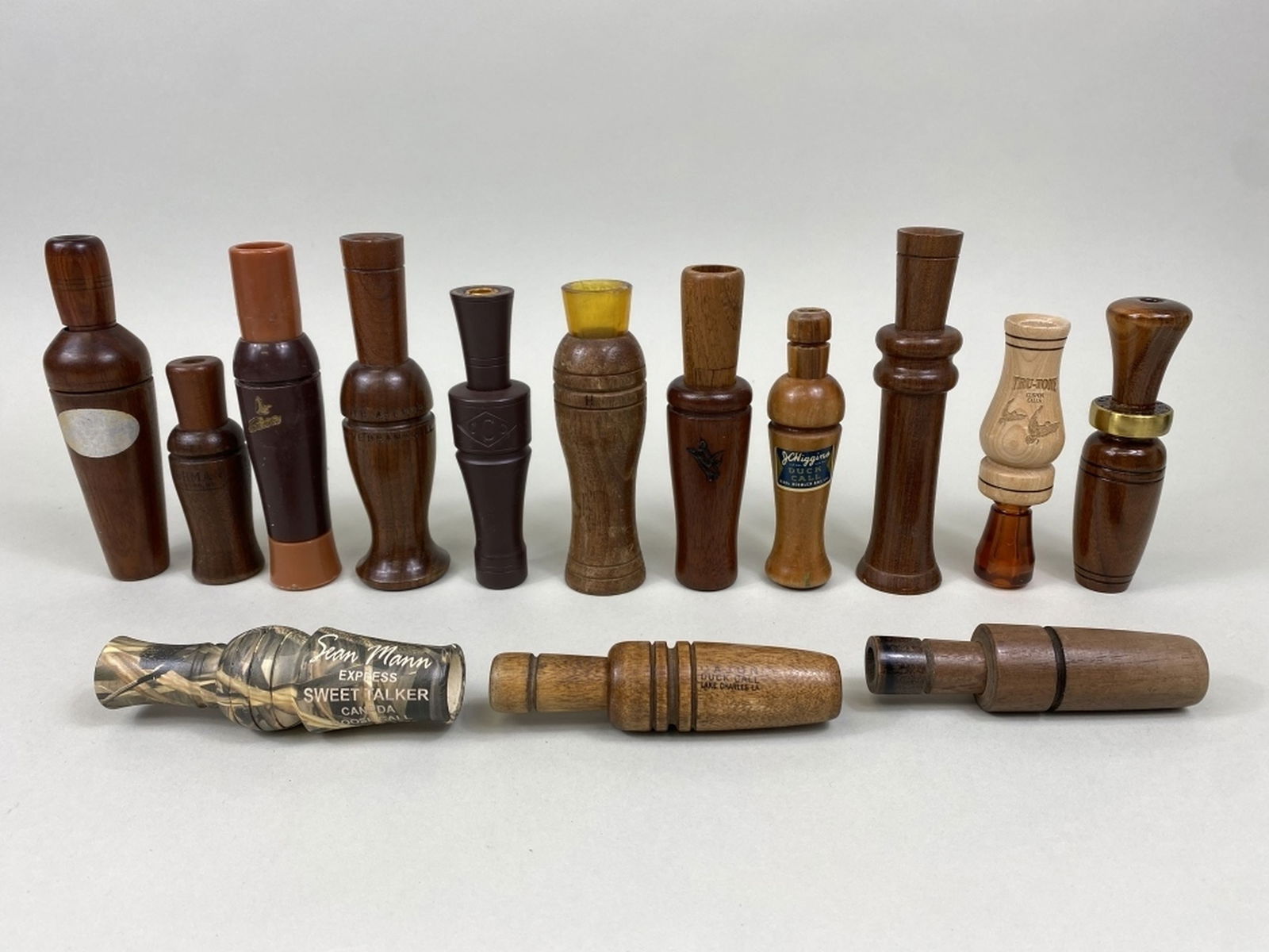 14 Assorted Duck & Goose Calls: by various makers including Cajun, Melacon, Big River, Carlson, True Tone, Olt, Stay Dry, Lohman, Jim Blakemore, JC Higgins, Herters & Sean Mann, 1 unknown & 1 Dennison are missing guts, all others ar