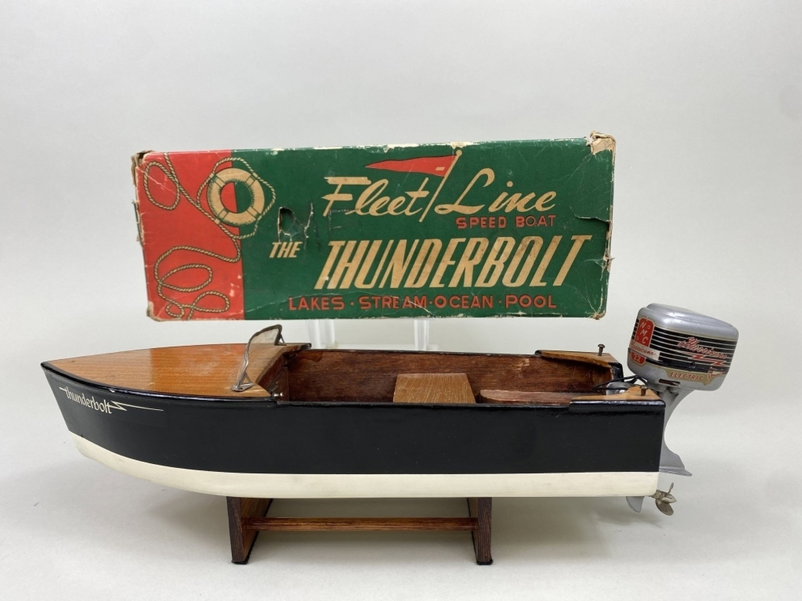 Vintage K&O Models Wooden Boat with Outboard Motor: The Fleet Line Speed Boat, The Thunderbolt, K&O Model, Inc., wooden boat is in good condition with some minor wear, includes battery operated Hurricane motor, original worn box included, removable sea