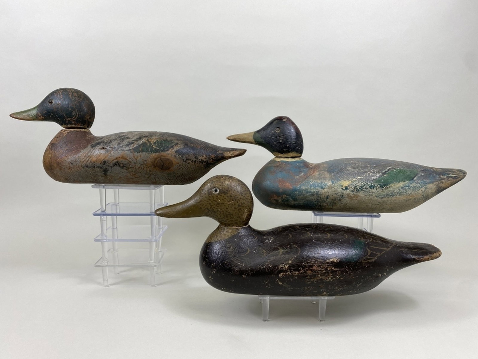 3 Mason Duck Decoys: Detroit, MI, standard grades, 1 mallard drake, glass eyes, solid body, worn original paint, shot marks, paint loss, neck filler missing, significant crack in bottom, 1 black duck, glass eyes, solid bo