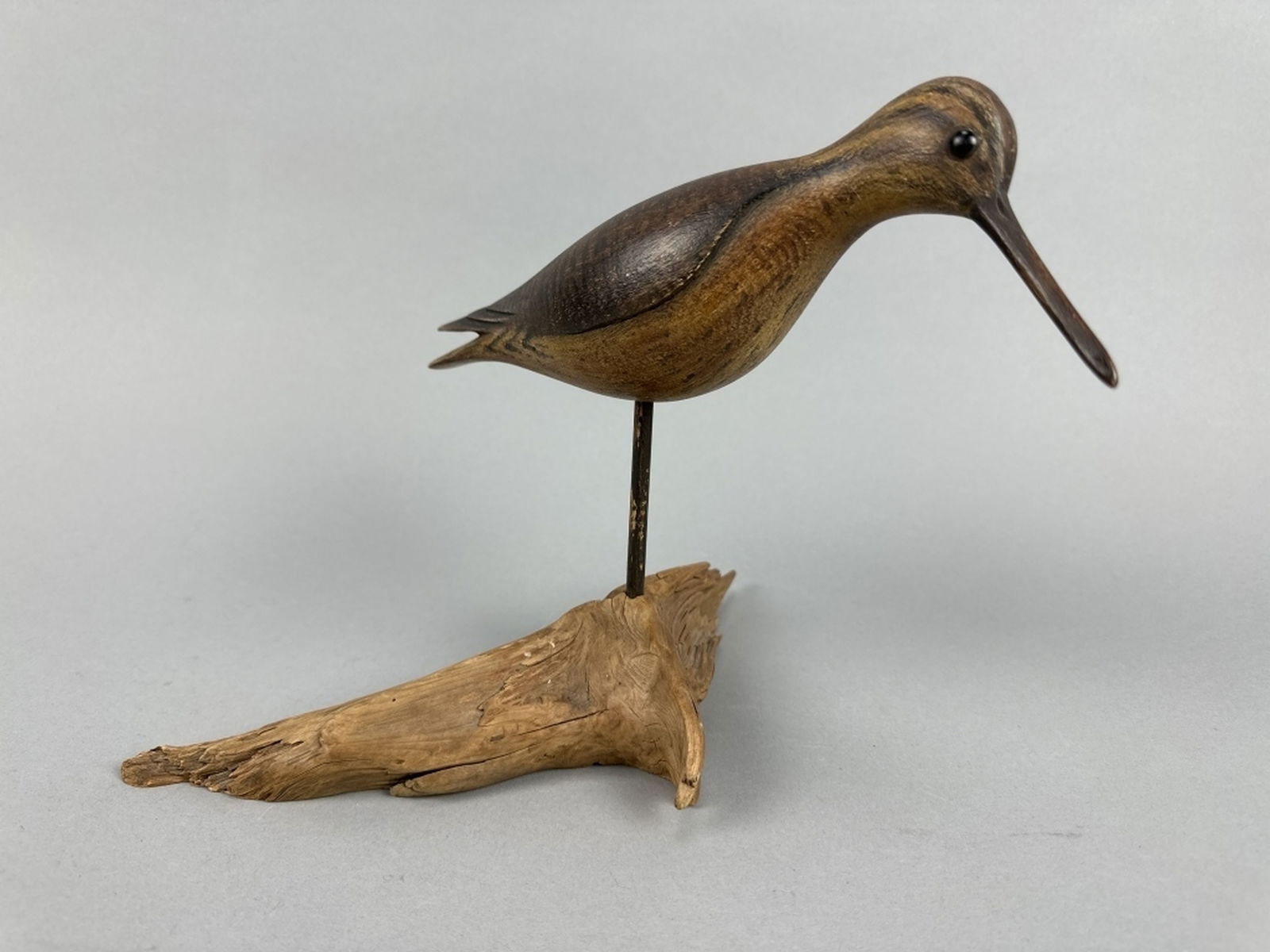David Ward Yellowlegs Shorebird: Essex, CT, glass eyes, strong original paint with distressed wear, great form with relief carved wing detail, head is turned slightly right, comes with driftwood stand, makers initials on bottom, Roge