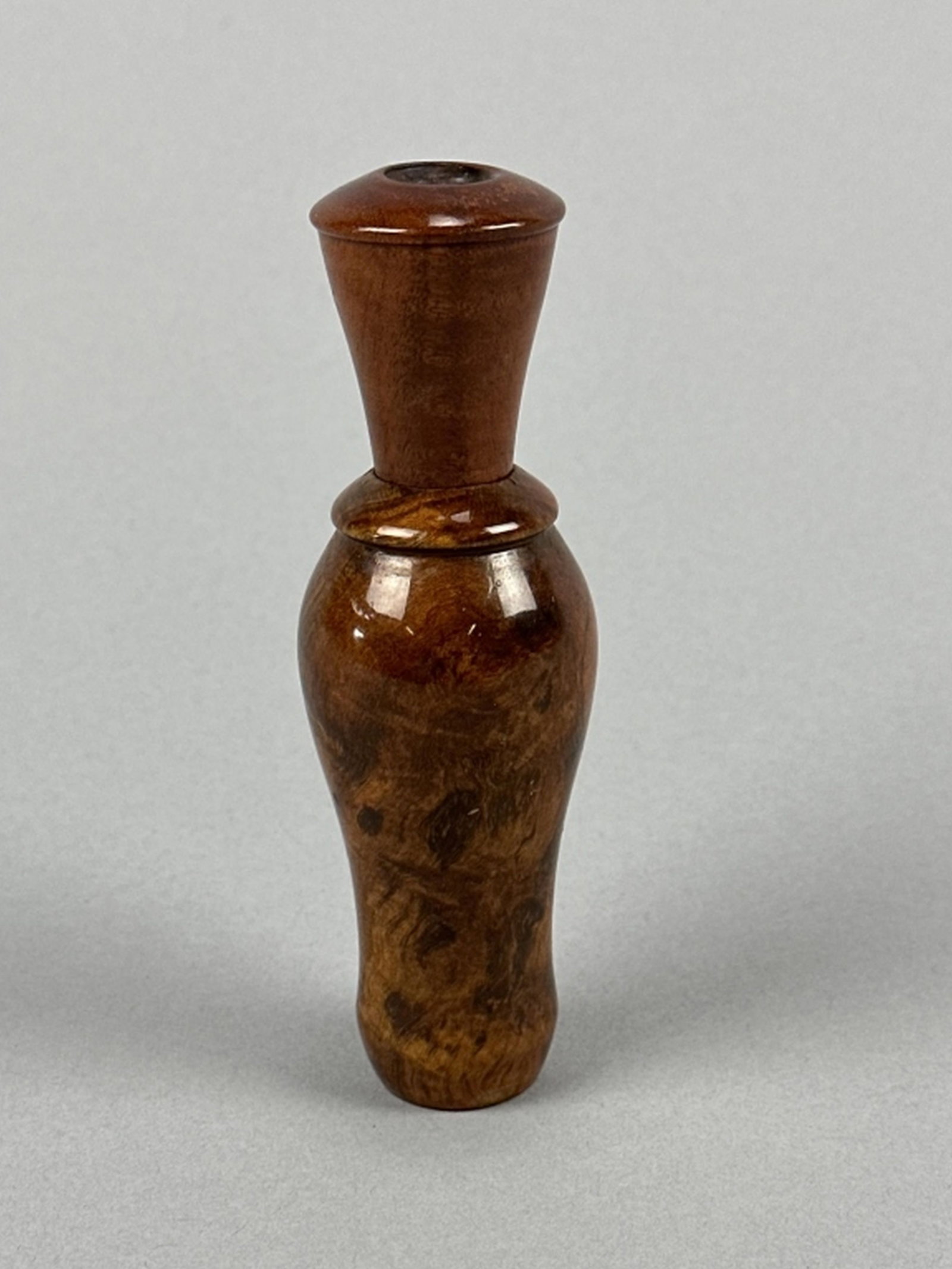 Chester A. Walker Duck Call: Trezevant, TN, high burl wood, in good condition, area where logo was is worn, otherwise in good condition, 5"L, est. 200 - 400