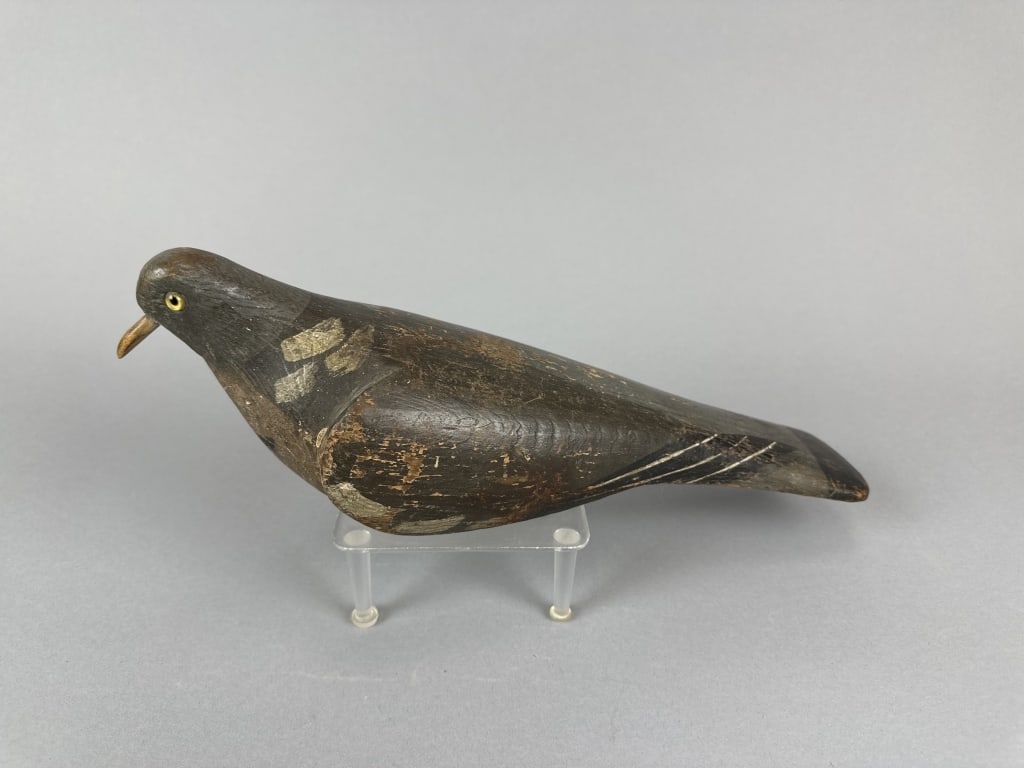 Antique English Pigeon Decoy: by unknown carver, glass eyes, solid body, original paint with some flaking & wear, wooden bill that has possibly been replaced with small amount of touchup where bill & face meet, 13.5"L, est. 500 - 