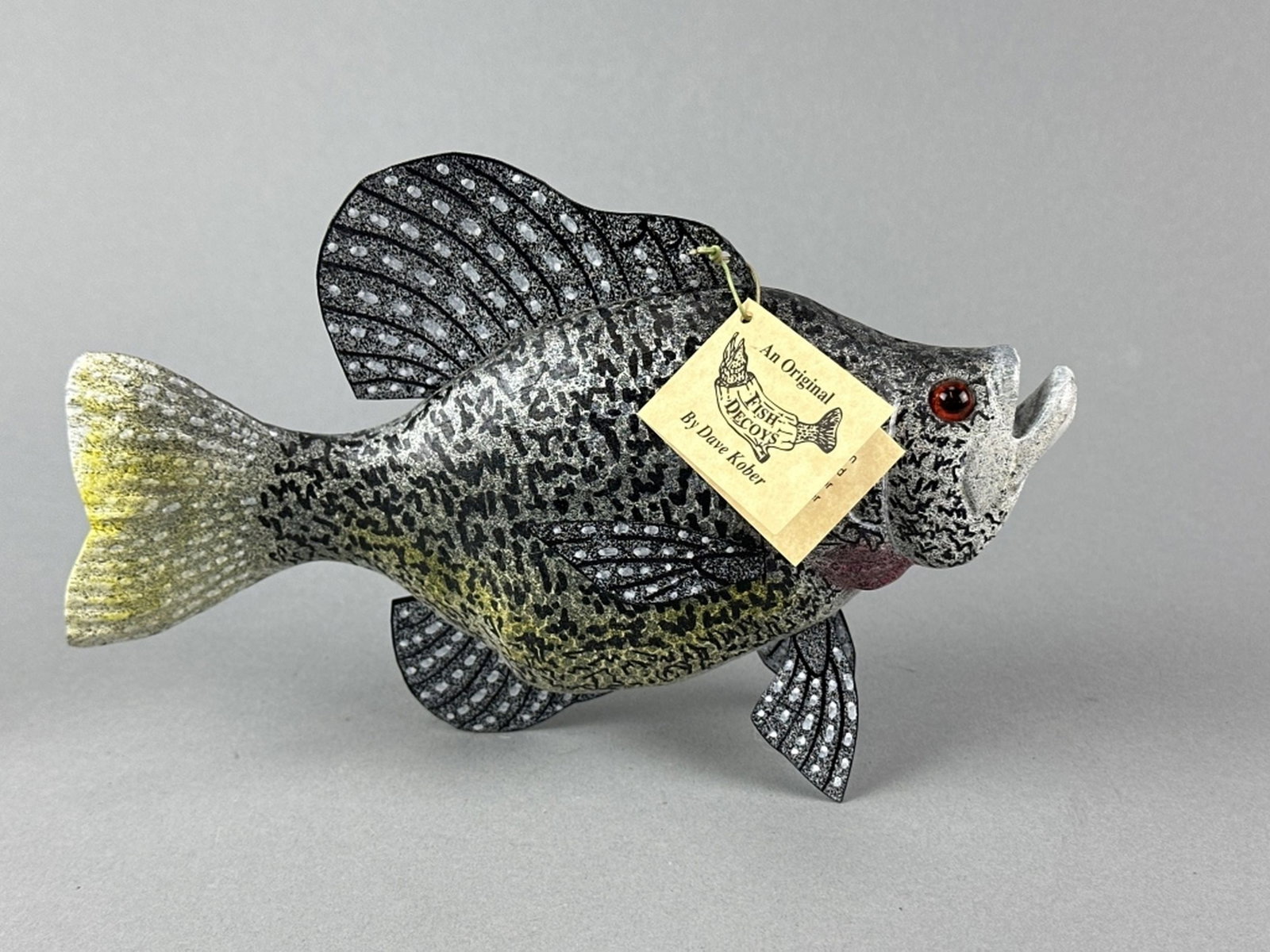Dave Kober Hand Carved Crappie: Beulah, MI, glass eyes, carved tail & metal fins, excellent condition, maker's signature on bottom, 9"L, est. 150 - 300