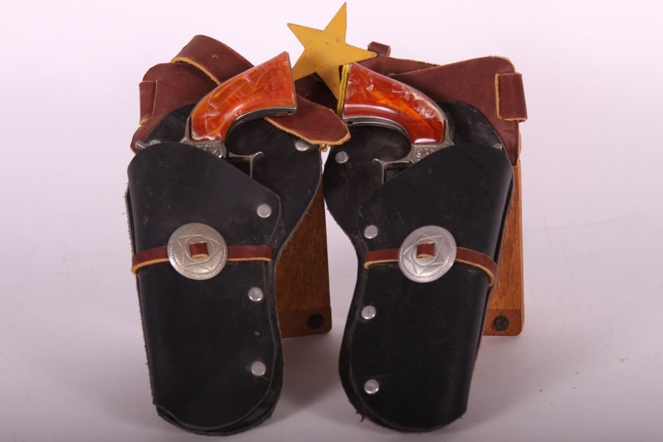 Pr of Hubley, Die Cast, Pioneer Cap Guns with Amber: Pr of Hubley, Die Cast, Pioneer Cap Guns with Amber Handles, Nickel Peeling, Triggers Don't Work, w/ Black Leather Holsters on Brown Leather Belt