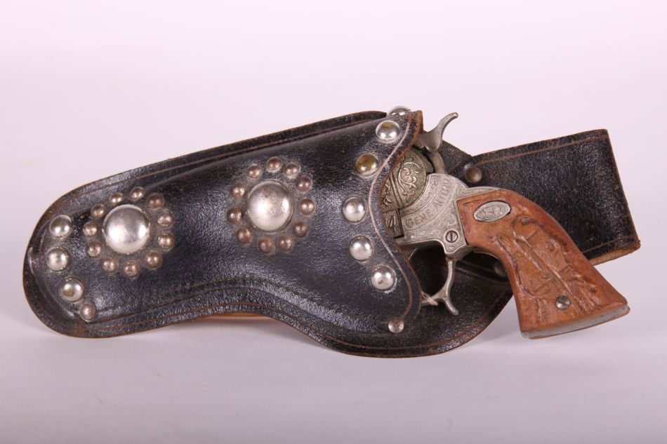 Leslie Henry, Die Cast, Gene Autry .44 Cap Gun w/ Brown: Leslie Henry, Die Cast, Gene Autry .44 Cap Gun w/ Brown Horse-Head Handle, w/ Black Leather Holster