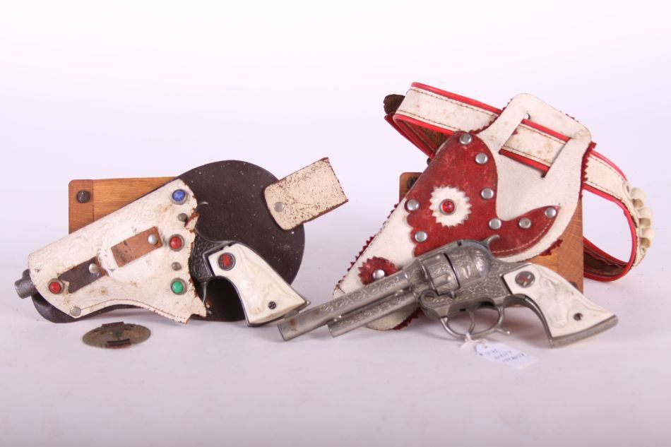 Pr. Of Hubley Texan Jr. Cap Guns, 1 Cast Iron & 1 Die: Pr. Of Hubley Texan Jr. Cap Guns, 1 Cast Iron & 1 Die Cast, w/ White Steer Head Grips, w/ One Holster with Belt and One Non-Matching Holster
