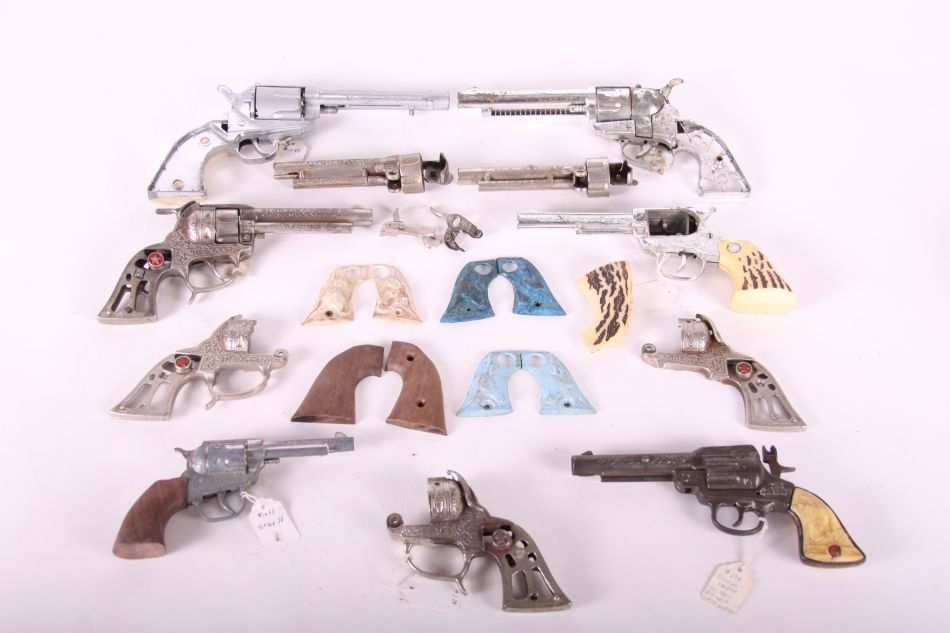 Lot of Disassembled Cap Guns and Parts, Including: Lot of Disassembled Cap Guns and Parts, Including Shootin' Shell .45, Texan, Fanner 50, Nichols, and one Cast Iron 'The Sheriff' by Stevens