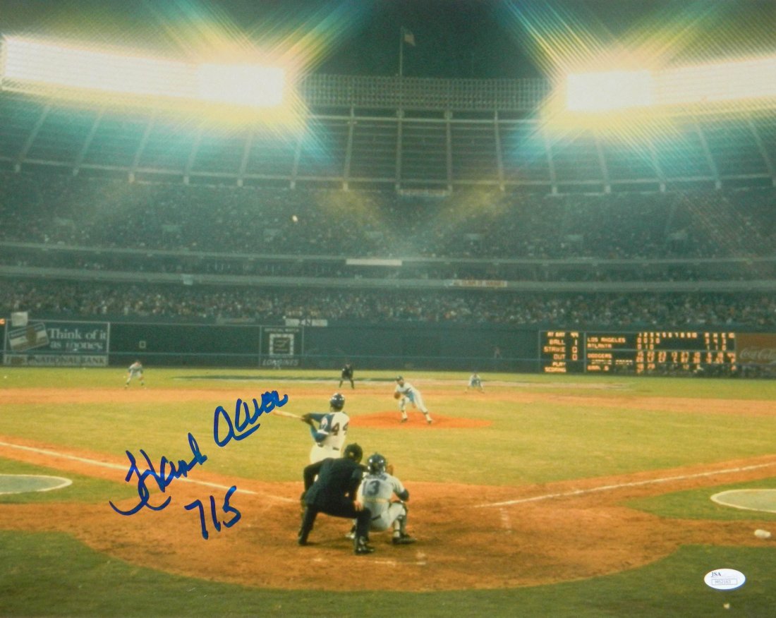 Hank Aaron Signed Atlanta Braves Record Breaking 715th : Hank Aaron signed Atlanta Braves record breaking 715th career homerun 16x20 photo with '715' inscription. Item comes with a JSA (James Spence Authentication) tamper evident numbered sticker and matchi