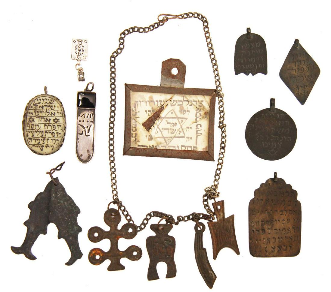 Lot of 10 different metal amulets, rare: Chain with kabbalistic shapesAmulet on paper in a metal and glass frame (broken with some missing text)Amulet for hanging, a tough material attached to metal, with Shema Yisrael and Ben Porat Yosef.Sm