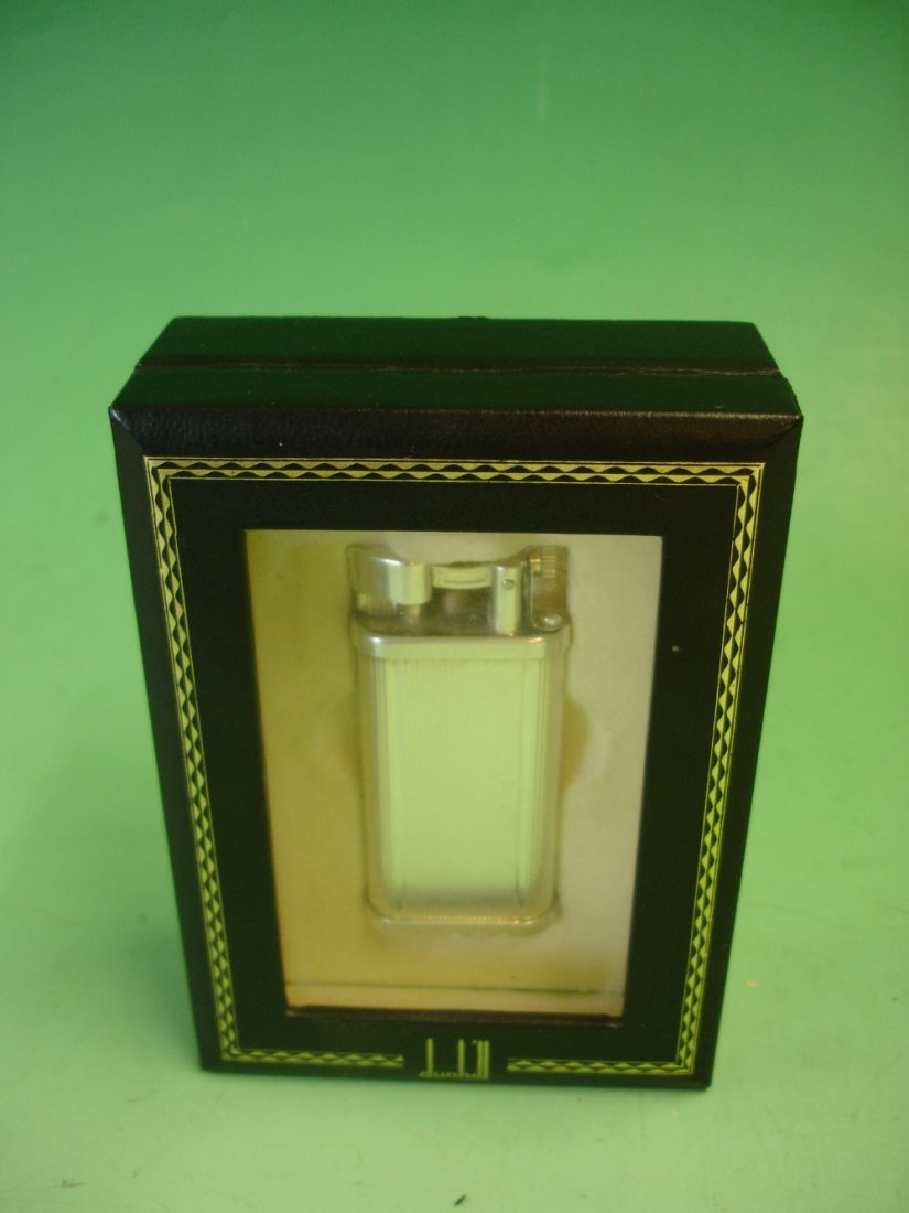 A Dunhill Unique Lighter No. 430339. Boxed: A Dunhill Unique Lighter No. 430339. Boxed with instruction manual.
