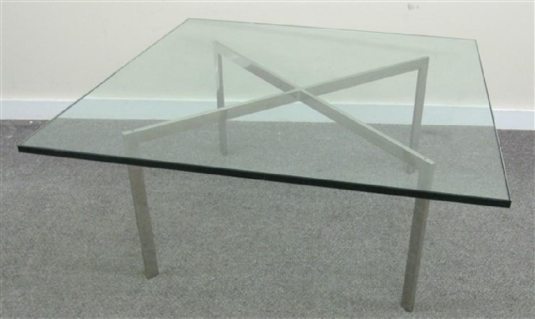 Mid Century Chrome & Glass Coffee Table: Mid Century Chrome & Glass Coffee Table- Mies Van Der Rohe/Knoll Barcelona Coffee Table Square plate glass top on polished chrome X-base. 40" w. x 40"d. x 17"h