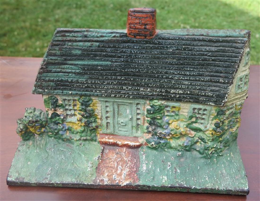 Vintage cast iron "cottage" doorstop: Vintage cast iron "cottage" doorstop