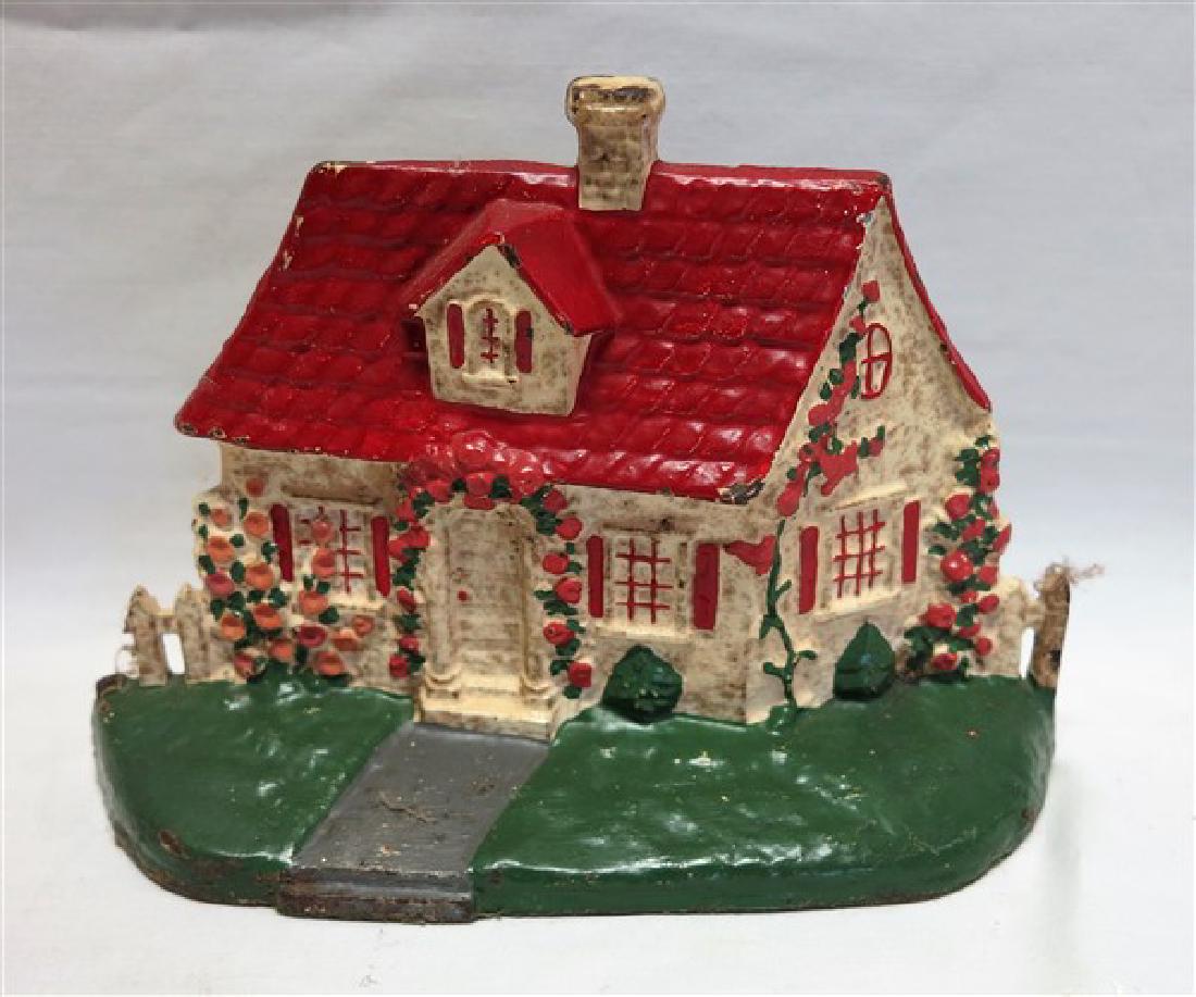 Cast iron cottage doorstop: Cast iron cottage doorstop