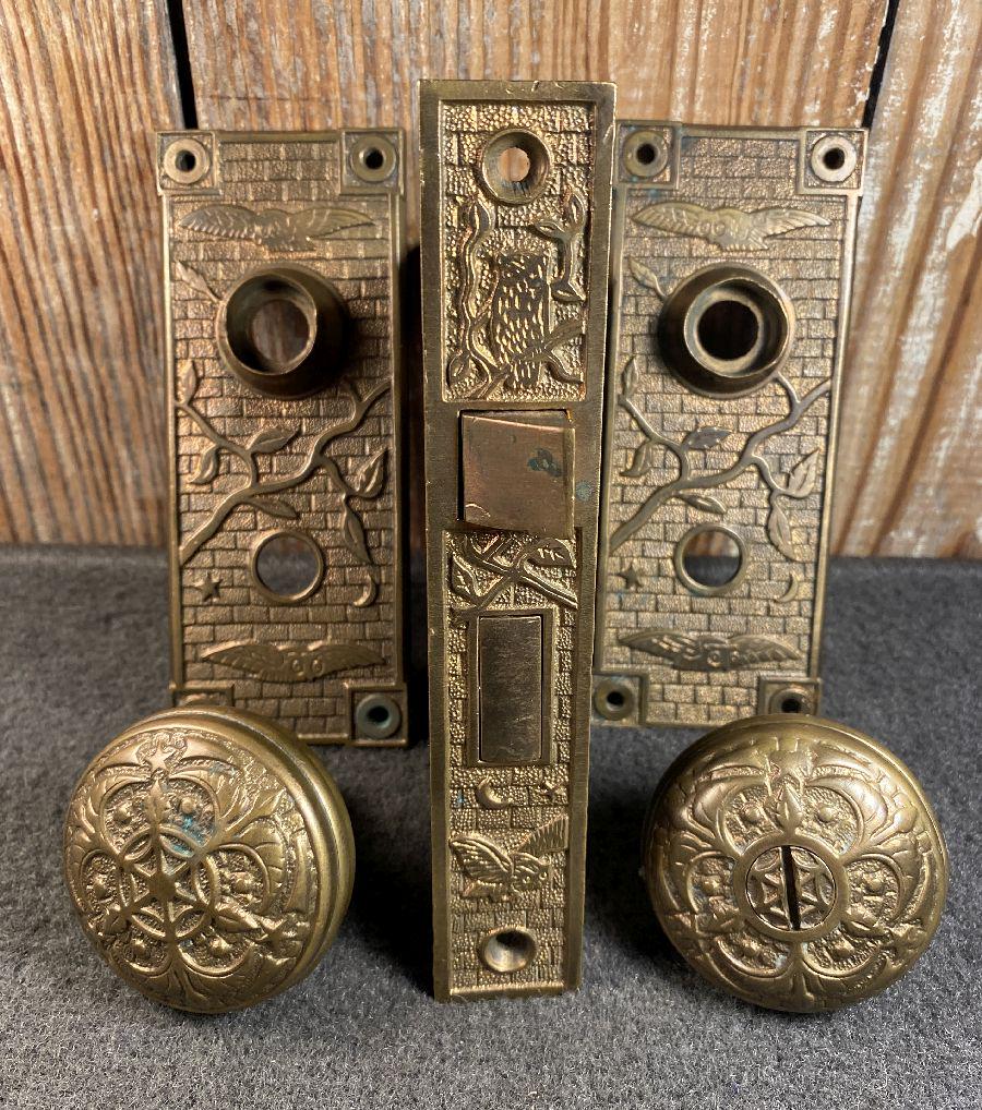 Owls: Passage lock set likely from Penn Hardware with a spooky owl scene...two plates 5" x 2", two passage knobs with spiderweb designs, and a mortise lock with decorated front...a scarce design in excellen