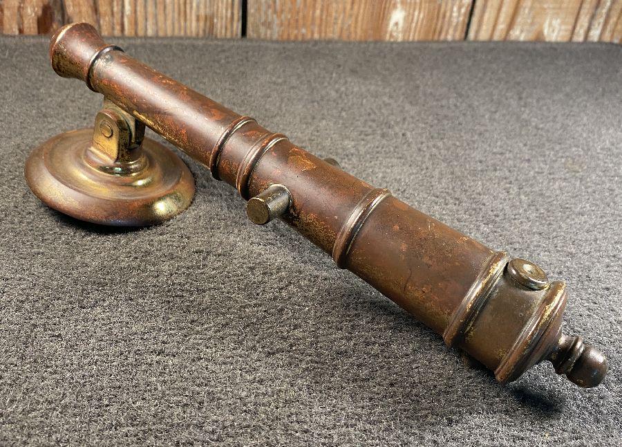 Cannon Door Knocker: Cast bronze cannon door knocker with great detail...9" long...excellent condition...