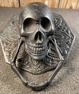 Skull & Bones Door Knocker: Bronze skull & bones door knocker, 5" x 5", perhaps from a fraternal meeting hall...goes well with the lion in lot 225...overall excellent shape for being in that condition.