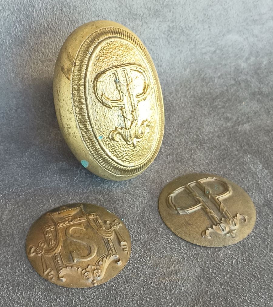 How Doorknob Are Made (3): More parts and pieces, this time for the Copley Plaza in Boston, built by the same folks as did the Plaza in NYC, plus a disc for one of those Statler knobs in Lot 18...as found